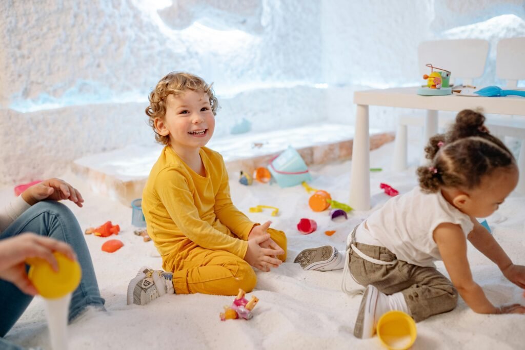 Children enjoying playful activities indoors, showcasing joy and creativity.